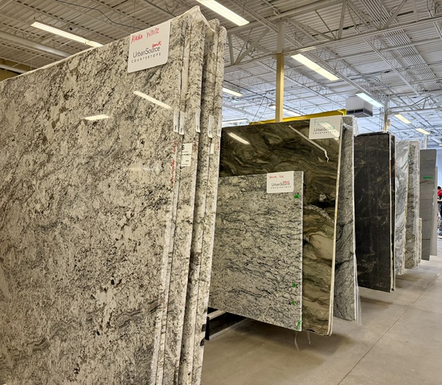 Natural stone slabs on display inside the UrbanSource showroom