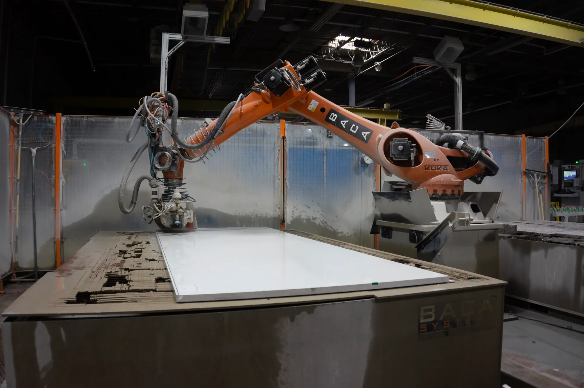 UrbanSource robotic fabrication equipment processing a stone slab in the Raleigh shop