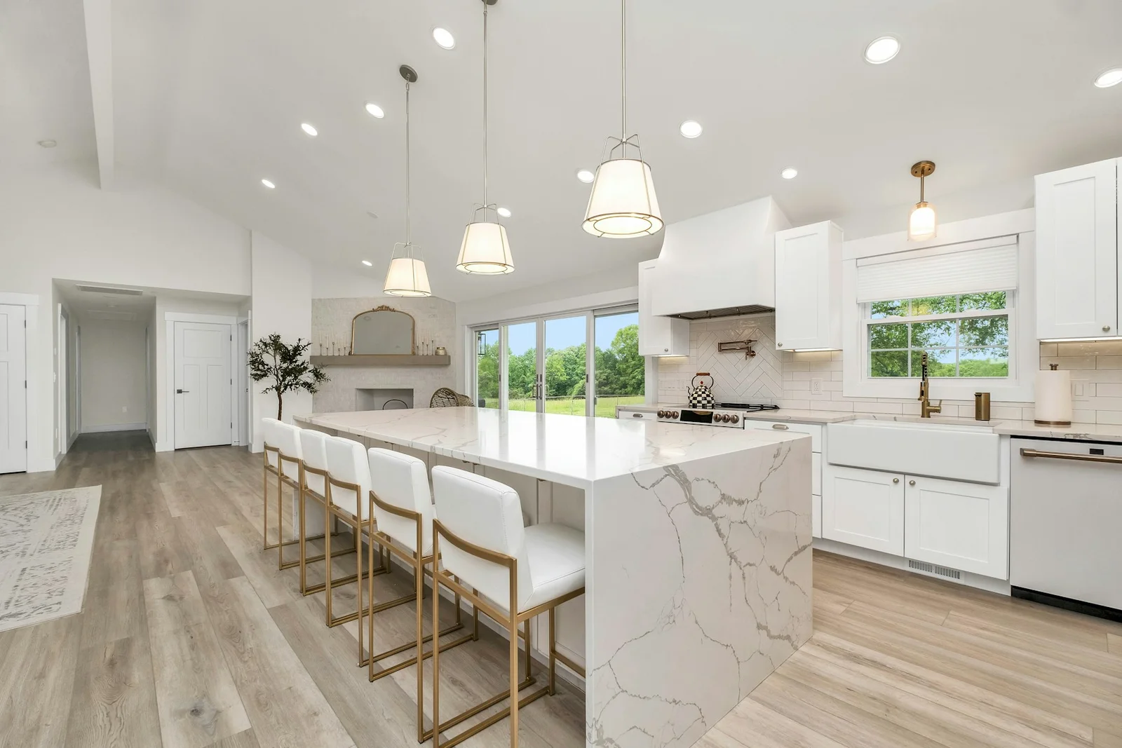 Modern kitchen with full-height stone backsplash and island